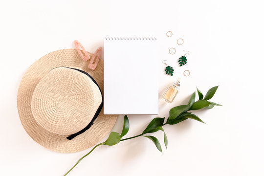 Spiral Notepad Mockup With Straw Hat, Women's Accessories And Green Ruscus Branch