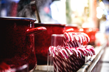 Santa's red-white caramels and pots with hot mulled wine at the Christmas market. Kiev. Ukraine.