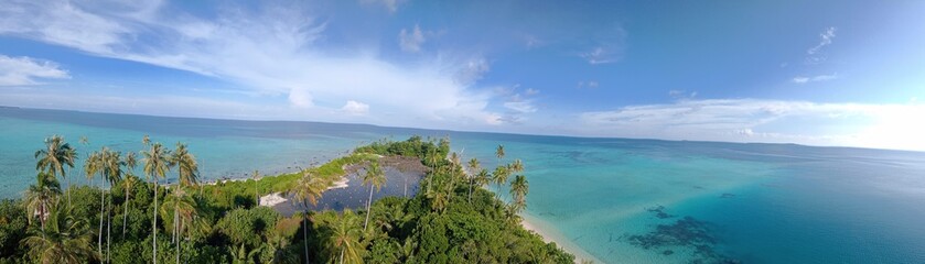 island in the Panoramic View Of Beach Against Cloudy Sky - stock photo