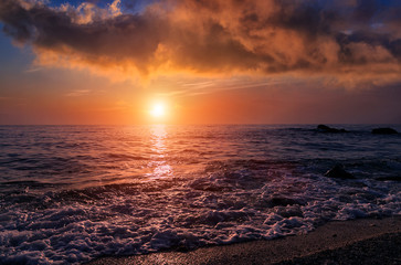 Awesome seascape during sunset. Beach, calm sea and colorful sky under sunlit. Summer view of Beach. Wonderful nature scene of Ionian sea. Adventures and exotic travel concept. dramatic scene