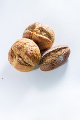 Group of tree whole grain bread with seeds on light