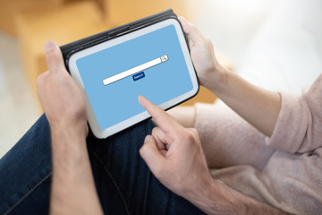 Couple holding digital tablet