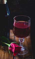 Glass of Wine and Red Rose