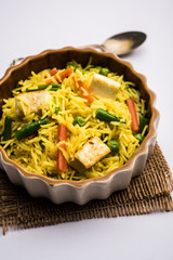 vegetarian paneer biryani at black background