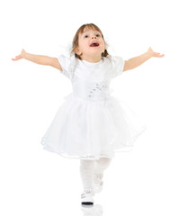 Happy little girl posing in white dress