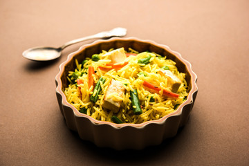 vegetarian paneer biryani at black background