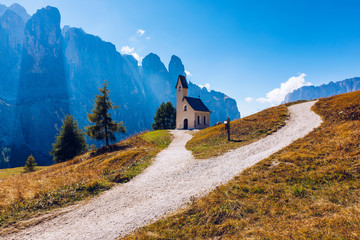 Chapel of San Maurizio at Passo Gardena, South Tyrol, Italy.  View to path to small white chapel...