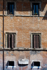 facade of an old building windows and shutters