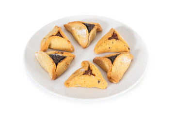 Haman's ears are also called Hamantaschen - a traditional Jewish pastry for Purim holiday. Organized in interesting shapes and isolated on a white background.
