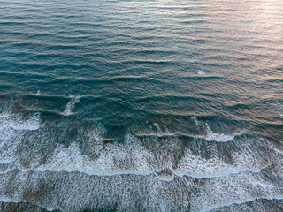 aerial view at empty beach with sea waves
