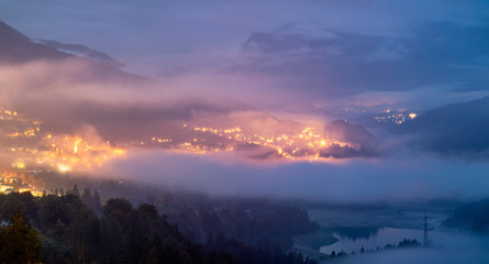 Naklejka premium Panoramic view of lake of Centro Cadore in the Alps in Italy, Dolomites, near Belluno. View of Lake Calalzo, Belluno, Italy. Lake of Centro Cadore in the Alps in Italy, near Belluno.