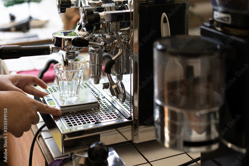 Wall mural barista making espresso with coffee machine