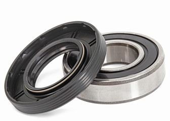 Ball bearing and oil seal for machine repair, isolated on white background