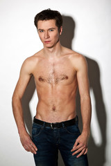 Fototapeta premium Attractive guy posing on white background