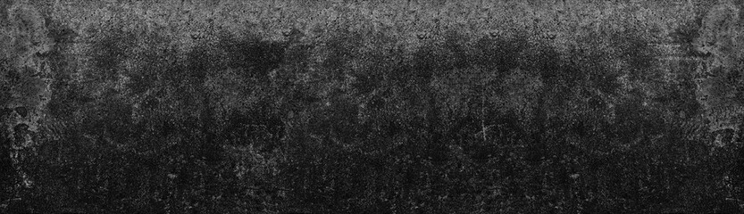 Dark gray old messy concrete wall large texture. Black shabby cement surface panorama. Grungy industrial backdrop