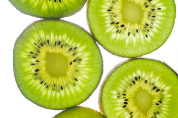 round kiwi slices on a white background. Isolated on white. close up