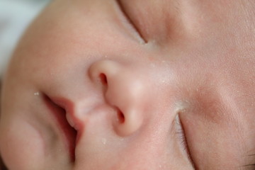 close up cute face of newborn baby softness sensitive skin