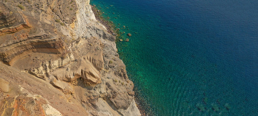 Aerial drone ultra wide photo of White beach and rocky bay in volcanic island of Santorini, Cyclades, Greece