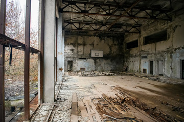 Fototapeta na wymiar Abandoned Gym in ghost town Prypiat in Chornobyl exclusion zone. Pripyat, Ukraine, December 2019