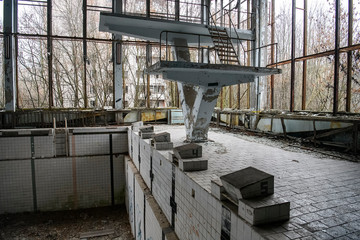 Abandoned Swimming Pool in in ghost town Prypiat in Chornobyl exclusion zone. Ukraine, December 2019