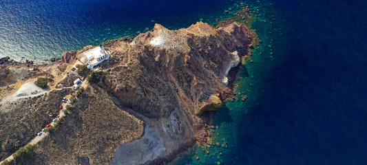 Aerial drone ultra wide photo of picturesque lighthouse built in Akrotiri peninsula area, Santorini volcanic island, Cyclades, Greece