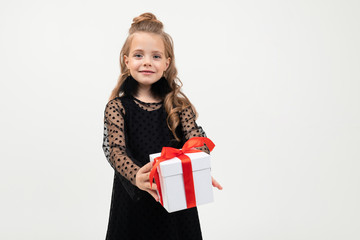 Fototapeta premium valentine's day concept. happy child holds a gift in his hands on a white background