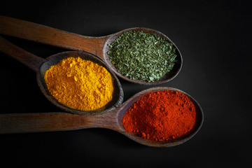 Spices on black background