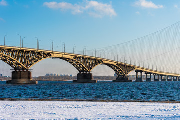 View of the Saratov bridge across the Volga through the grid