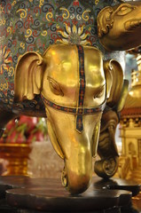 elephant head decoration for a tripod