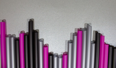 colorful drinking straws in different lengths