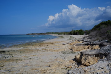 Blue sea, rocky beaches, blue skies are the perfect combination to spend a sunny day at Katewel beach clusters, Southwest Sumba, NTT, Indonesia.