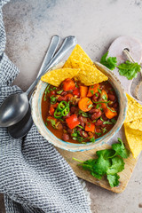 Mexican bean soup with nachos. Healthy vegan food concept.