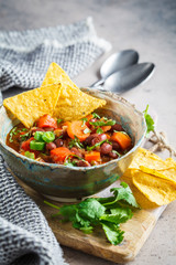 Mexican bean soup with nachos. Healthy vegan food concept.