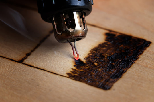 Pyrography. Wood burning with pyrography pen. Close up