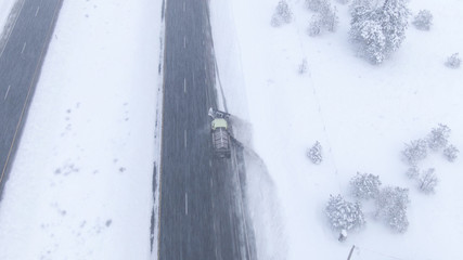 DRONE: Flying through an intense snowstorm as snowplow clears the icy highway
