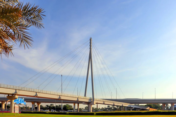 Dubai, UAE December 25/2018 Modern bridge. United arab emirates. Dubai sunset background. - obrazy, fototapety, plakaty