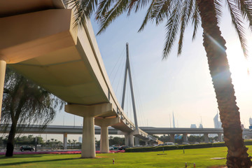 Dubai, UAE December 25/2018 Modern bridge. United arab emirates. Dubai sunset background. - obrazy, fototapety, plakaty