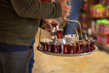 a man at the market sells Turkish tea