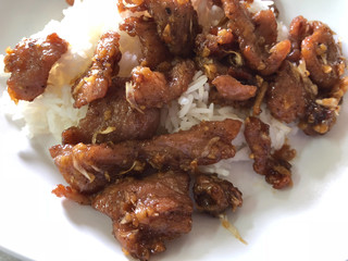 Steam rice and stir-fried pork with garlic, Thai food.