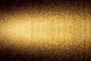 Golden background. Abstract twinkled bright background with bokeh defocused golden lights.