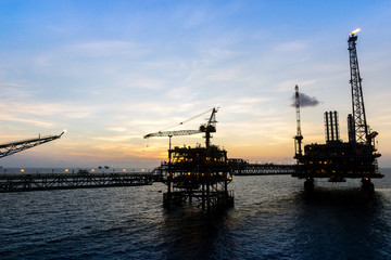 Fototapeta na wymiar Offshore production platforms complex connected with bridges at oil field