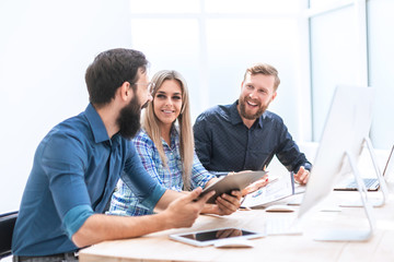 group of business people discussing financial documents