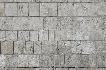 Grey modern coble stone background. Close up top view on monotone gray brick stone. Sidewalk or pavement.