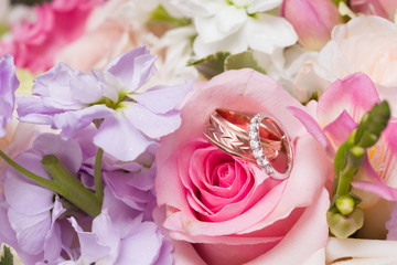 Wedding rings in bridal bouquet