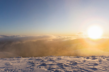 Beautiful panoramic view of sunrise in winter carpathians.  Borzhava ridge. Ukraine