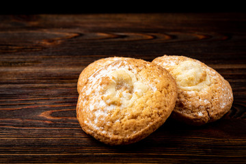 Cottage cheese (cheesecake) cookies on dark wooden background.