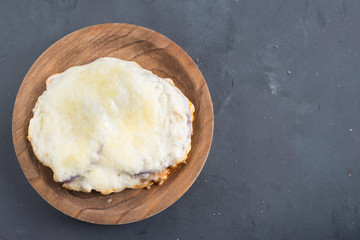 Moussaka, eggplant of aubergine. Top view in black background
