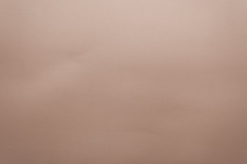 An old brown paper surface texture with a small pattern background. Suitable for backdrop and mockup