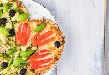 Vegetarian heart shaped pizza for Valentine Day.