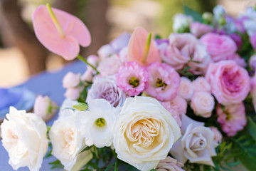 Bouquets of fresh flowers decoration of the festive table. Celebrating an open air party. Decor Details